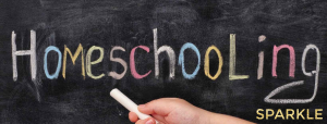 coloured chalk handwriting on blackboard says "homeschooling" and Sparkle logo